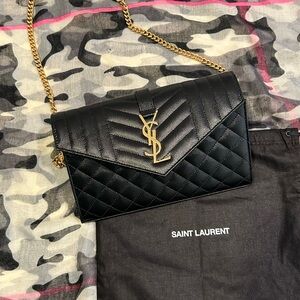 Saint Laurent wallet in embossed leather with metal YSL monogram detail